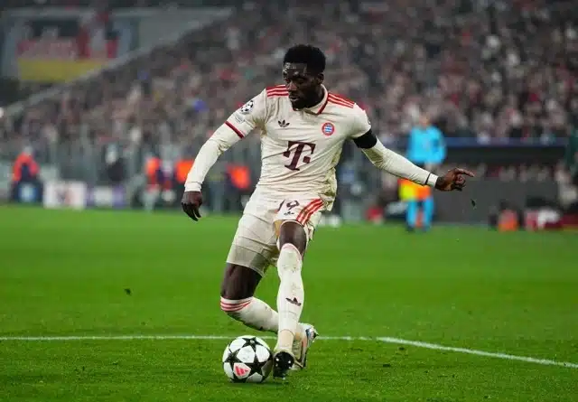 Alphonso Davies of Bayern Munich controls the ball
