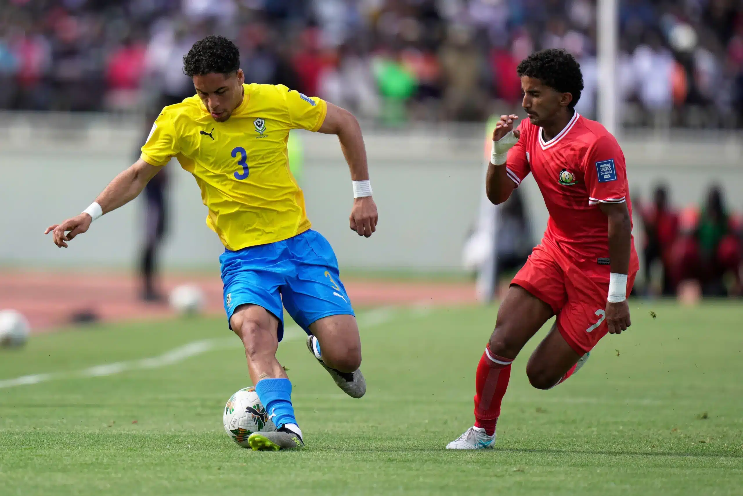 Gabon's Jérémy Oyono, left, challenges Kenya's Mohammed Bajaber during the World Cup group F qualifying soccer match between Kenya and Gabon