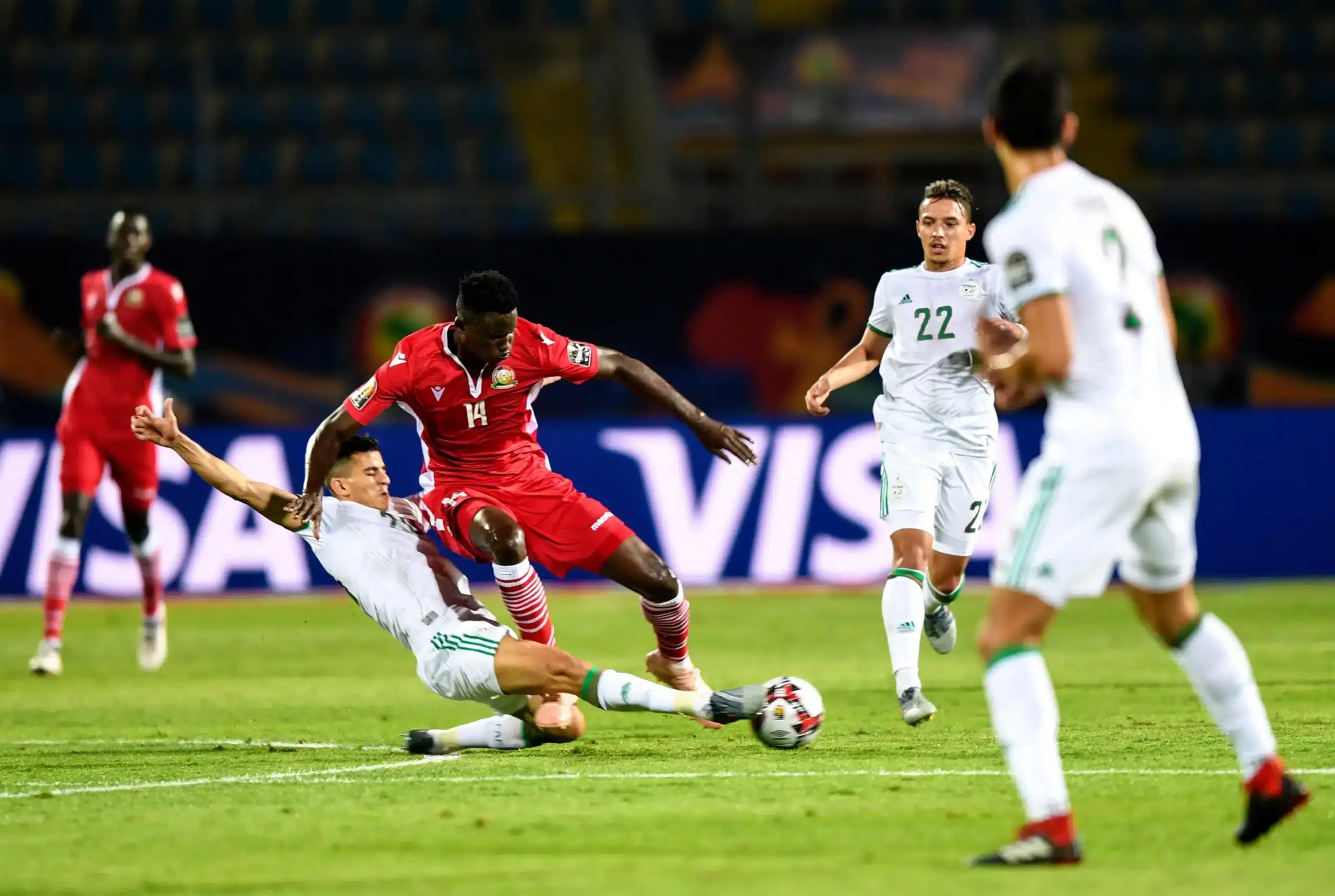 Michael Olunga (3rd R) of Kenya vies with Youcef Atal (4th R) of Algeria during the 2019 African Cup of Nations Group C match