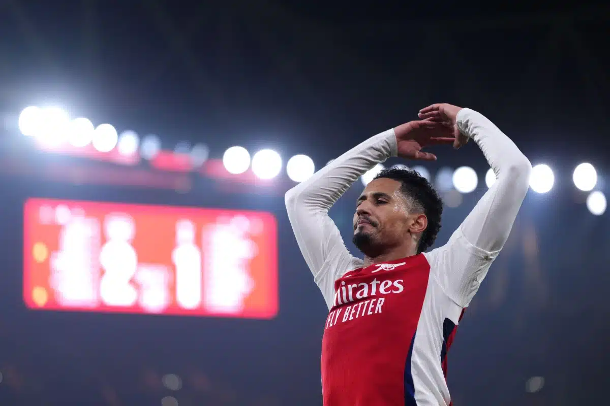 Arsenal's William Saliba celebrates in front of the fans following victory in the Premier League match