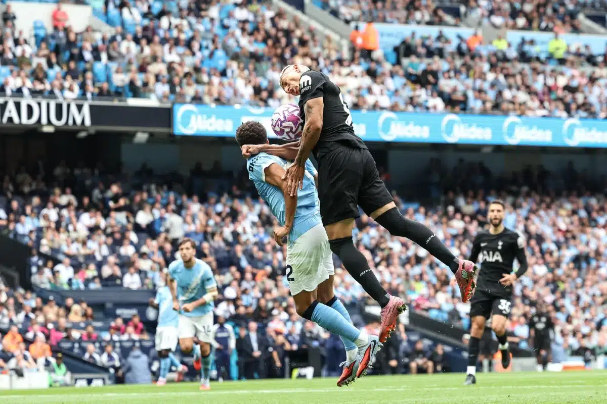 Rico Lewis of Manchester City pressures Richarlison of Tottenham Hotspur, 2025