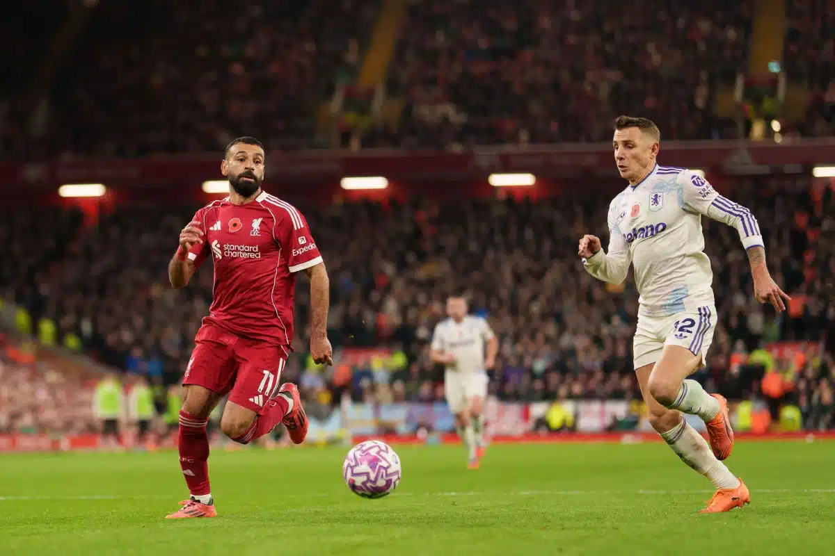 Mohamed Salah of Liverpool in action with Aston Villa's Lucas Digne, 2025