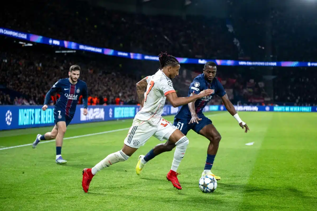 Michael Olise of Bayern Munich in a duel with Willian Pacho of PSG, PSG vs. Bayern Munich, Champions League, November 4, 2025